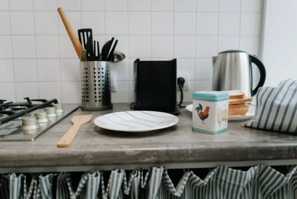 Cluttered kitchen counter with too many utensils showing tool buying mistakes